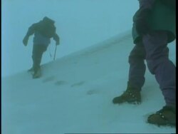 MS people trekking through snow, wearing crampons on boots, Uganda, Africa Stock Footage