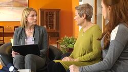 Adult Daughter and Mom Talk with Professional Woman Stock Footage
