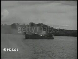1943: NEW BRITAIN CAMPAIGN: VS Medic taping wounded back of U.S. Army 112th Cavalry Regiment solder, another holding helmet w/ bullet holes. VS Rockets being fired from landing crafts, soldiers landing on beach, firing anti-aircraft artillery. WWII Instructional Video