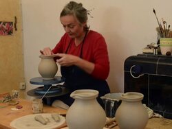 MS Shot of female potter shapes and makes handle to pitcher / Landshut, Bavaria, Germany Stock Footage