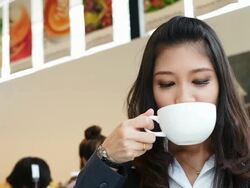 Relaxed business woman drinking Stock Footage
