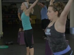 Carly and Tali perform dowl squat warm-ups. Stock Footage