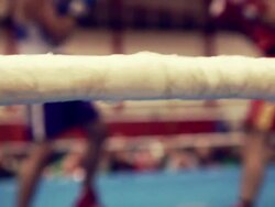 C/U Ropes of the ring, fight in background out of focus Stock Footage