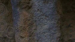 C/U to M/S cave sactuary w/ rock carvings Stock Footage