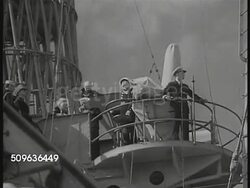 1940: US NAVY SHIPS: VS Navy Battleships on ocean, Officers on watch, distant airplanes flying, sailor reporting to commanding officer, ship's Captain. More Battleships, destroyers, profile of Battleship's guns on deck. Instructional Video