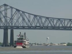 WS Steam boat approaching to near  bridge over mississippi river  / New Orleans, Louisiana, United States  Stock Footage