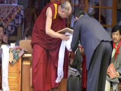 MS Dalai Lama  presenting  with gift book by attendant at his 70th birthday AUDIO / Dharmasala, Himachal Pradesh, India Stock Footage