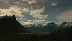 Clouds rush over mountains and valleys. Stock Footage