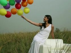 Young woman playing with balloons in the forest Stock Footage