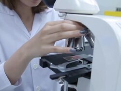 HD : Scientist Couple using microscope Stock Footage