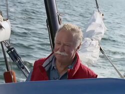 MS SLO MO Happy pensioner sailing his boat at full speed / Wismar, Mecklenburg-Vorpommern, Germany Stock Footage