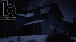 Static shot of a country home in the countryside by night in the snow Stock Footage