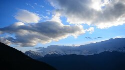 Snow Mountain Landscape at Sunset and Cloudscape Stock Footage