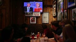While debating Hillary Clinton, Donald Trump is shown on TV talking about his economic policy proposals at Nick's English Hut in Bloomington, Indiana. Stock Footage