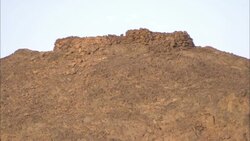 The ruined walls of Shenshef remain on a desert hill in Egypt. Stock Footage