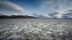 Dry, cracked earth and clouds Stock Footage