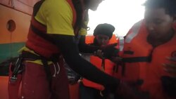 Migrants rescued from wooden boat off Libya Instructional Video