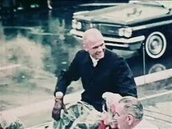1962 John Glenn riding in convertible in parade waving / his wife + Vice President Johnson in car Stock Footage