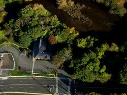MS AERIAL ZI DS Shot of covered bridge surrounded by tree / Connecticut, United States Stock Footage