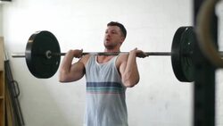 Young man athlete lifting weights Stock Footage