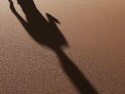 Walking barefoot over sanddunes Stock Footage