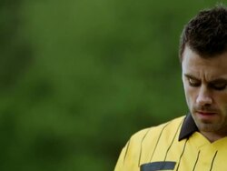 MS TD TU referee blowing whistle and showing yellow card on field to professional soccer player arguing call Stock Footage