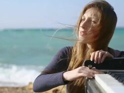 girl playing on an old piano Stock Footage