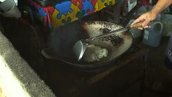 Female cook omelet in pan with thai style cuisine and food. Stock Footage