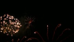 Colorful fireworks burst against a night sky. Stock Footage