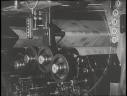 Newspaper spins through a printing press. News Clip
