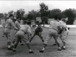B/W 1938 group of professional baseball players in circle passing around medicine ball Stock Footage