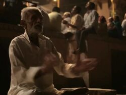MS Man clapping and praying by Ganges river / Varanasi, India Stock Footage