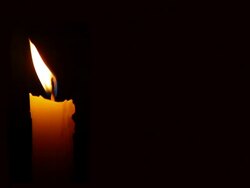 HD Moving single lit candle flame in the wind Stock Footage