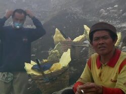 MS Men carrying sulfur from the mining at the ijen volcano / Ijen, Java, Indonesia Stock Footage