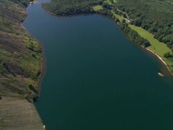 Aerial view over forest and Wast Water in the Lake District / Cumbria, England Stock Footage