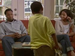 MS, couple listening to son (6-7) play saxophone in living room, Westfield, New Jersey, USA Stock Footage