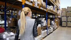 Examining the stocks in storage room Stock Footage
