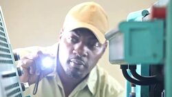 Repairman examining equipment with flashlight Stock Footage