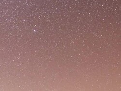 WS POV PAN ZO T/L Night sky revealing rocks and yucca palm trees / Joahua Tree National Park,  CA, United States Stock Footage