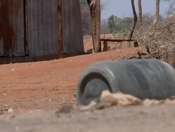 Woman rolls water canister Stock Footage