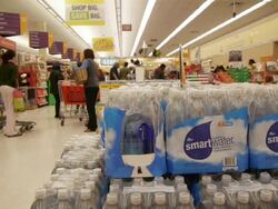Cases of bottled water at the grocery store Stock Footage