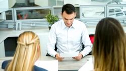 Business man in a meeting with a couple of clients Stock Footage