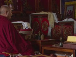 MS Monk sitting patiently next to holy texts and shrine / Kathmandu, Central Region,Nepal Stock Footage