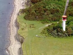  AERIAL WS View of small lighthouse at near ocean / Holstein Switzerland, Schleswig-Holstein, germany Stock Footage