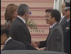 WRAP Brown, Merkel arrive at G8 summit ADDS Ban News Clip