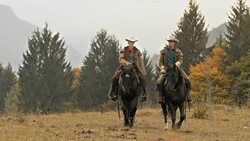 DS Cowboy and cowgirl enjoying their horseback ride in nature Stock Footage