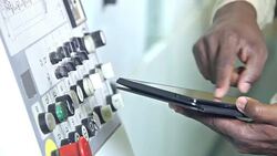 Hands of black man at control panel with digital tablet Stock Footage