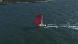 A J11 sailboat cruises downwind across Rhode Island Sound. Stock Footage