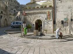 MS Old man fills jerry can of water in street source / Matera, Basilicata, Italy  Stock Footage