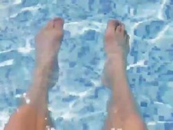 POV, Feet in swimming pool, Greece Stock Footage